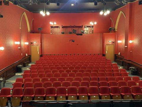 Red-walled theatre auditorium